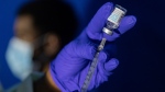 Family nurse practitioner Carol Ramsubhag-Carela prepares a syringe with the Mpox vaccine before inoculating a patient at a vaccinations site on, Aug. 30, 2022, in the Brooklyn borough of New York. (Jeenah Moon / AP Photo, File)