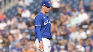 Toronto Blue Jays pitcher Bowden Francis reacts as he stands on the mound after New York Mets Francisco Lindor hits a solo home run to end Francis' no hitter hopes during ninth inning interleague MLB baseball action in Toronto, Wednesday, Sept. 11, 2024. THE CANADIAN PRESS/Chris Young