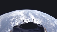 This image provided by SpaceX on Tuesday, Sept. 10, 2024, shows a view of Earth and the Dragon capsule's Skywalker spacewalk platform shortly after the Polaris Dawn crew launched into an orbit. (SpaceX via AP)