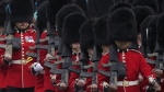 Soldiers from the Irish Guards march along the Mall as they take part in the Trooping the Color ceremony, in London, Saturday, June 15, 2024. (AP Photo/Alberto Pezzali, File)