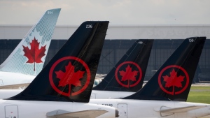 Air Canada logos are seen on the tails of planes at the airport in Montreal on Monday, June 26, 2023. THE CANADIAN PRESS/Adrian Wyld