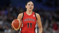 Natalie Achonwa dribbles during a women's basketball game against Australia at the 2024 Summer Olympics, in Villeneuve-d'Ascq, France, Thursday, Aug. 1, 2024. THE CANADIAN PRESS/AP-Michael Conroy