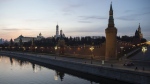 The Kremlin and embankment of the Moscow River are seen during sunset in Moscow, Russia, on Saturday, March, 28, 2020. (AP Photo, File)