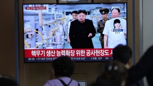 North Korean leader Kim Jong Un during a news program at the Seoul Railway Station, Friday, Sept. 13, 2024. The letters read, "North Korea, unveiling the uranium enrichment facility for the first time," and "the construction site for expanding the capacity for the production of nuclear weapons." (AP Photo/Lee Jin-man)