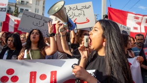 Tunisians take part in a protest against President Kais Saied ahead of the upcoming presidential elections, Friday, Sept. 13, 2024, on Avenue Habib Bourguiba in the capital Tunis. (AP Photo/Anis Mili) 