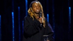 FILE - Lil Wayne accepts the Recording Academy global impact award at the Black Music Collective on Thursday, Feb. 2, 2023, at The Hollywood Palladium in Los Angeles. (AP Photo/Chris Pizzello)