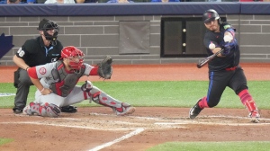 Toronto Blue Jays' catcher Alejandro Kirk (30) hits a go ahead single against the St. Louis Cardinals in the 4th inning during MLB baseball action in Toronto, Friday September 13, 2024. THE CANADIAN PRESS/Chris Young