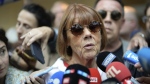 Gisele Pelicot speaks to media as she leaves the Avignon court house, southern France, Thursday, Sept. 5, 2024. A woman allegedly drugged by her ex-husband so that she could be raped by other men while she laid unconscious, is expected to testify before a panel of French judges. (AP Photo/Lewis Joly)