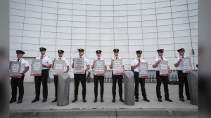 Air Canada pilots hold signs during an informational picket at Vancouver International Airport in Richmond, B.C., on Tuesday, August 27, 2024. Labour talks between Air Canada and its pilots are approaching a midnight deadline when either side could trigger the start of a shutdown for Canada's largest airline. THE CANADIAN PRESS/Darryl Dyck