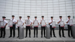 Air Canada pilots hold signs during an informational picket at Vancouver International Airport in Richmond, B.C., on Tuesday, August 27, 2024. Labour talks between Air Canada and its pilots are approaching a midnight deadline when either side could trigger the start of a shutdown for Canada's largest airline. THE CANADIAN PRESS/Darryl Dyck