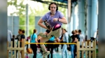 A participant clears the bar during the first German Hobby Horsing Championship in Frankfurt, Germany, Saturday, Sept. 14, 2024. (AP Photo/Michael Probst)