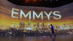 FILE - A crew member sweeps the stage during Press Preview Day for the 71st Primetime Emmy Awards in Los Angeles on Sept. 19, 2019. (Photo by Chris Pizzello/Invision/AP, File)