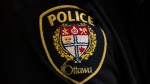 An Ottawa police officer’s badge is seen on Thursday, April 28, 2022 in Ottawa. Ottawa police say they have charged a 30-year-old man in the death of an infant, more than a year after the incident. THE CANADIAN PRESS/Adrian Wyld