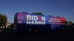 Democratic presidential candidate former U.S. vice president Joe Biden and Democratic vice presidential candidate Sen. Kamala Harris, D-Calif., ride on a bus in Phoenix, Oct. 8, 2020, on a small business bus tour. (AP Photo/Carolyn Kaster, File)