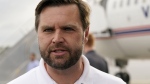 Republican vice presidential nominee Sen. JD Vance, R-Ohio, speaks to reporters before he departs Pitt-Greenville Airport following a campaign event in Greenville, N.C., Saturday Sept. 14, 2024. (AP Photo/Steve Helber)