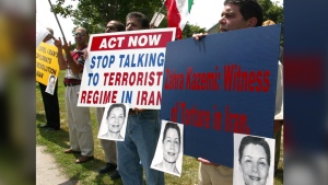 Demonstrators protest against Iran outside the Department of Foreign Affairs in Ottawa, Monday July 26, 2004. THE CANADIAN PRESS/Fred Chartrand