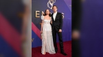 Yelena Yemchuk, left, and Ebon Moss-Bachrach arrive at the 76th Primetime Emmy Awards on Sunday, Sept. 15, 2024, at the Peacock Theater in Los Angeles. (AP Photo/Jae C. Hong)