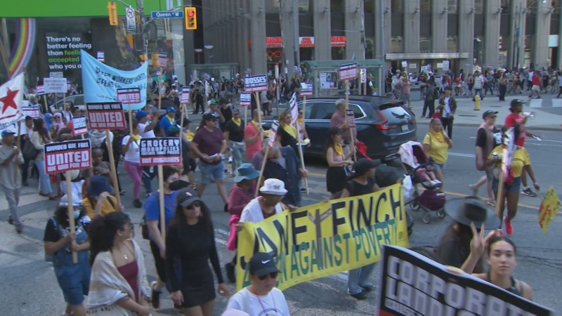 Demonstrators rallied for migrants right in downtown Toronot on Sept. 15. 