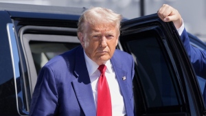 Republican presidential nominee Donald Trump arrives at Harry Reid International Airport to board a plane after a campaign trip, Saturday, Sept.14, 2024, in Las Vegas. (AP Photo/Alex Brandon)