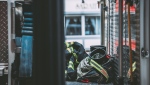 A firefighter's uniform is seen inside a fire truck (Pexels)