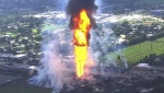 A pipeline fire in La Porte, Texas, sparks grass fires and burns power poles on Monday, Sept. 16, 2024, forcing people in the surrounding neighborhood to evacuate. (KTRK via AP)