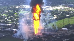 A pipeline fire in La Porte, Texas, sparks grass fires and burns power poles on Monday, Sept. 16, 2024, forcing people in the surrounding neighborhood to evacuate. (KTRK via AP)