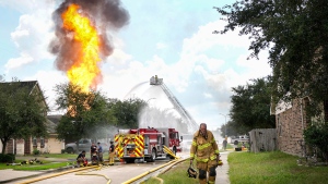 Firefighters battle a blaze from a pipeline carrying liquified natural gas that burns near Spencer Highway and Summerton on Monday, Sept. 16, 2024, in La Porte, Texas. (Brett Coomer/Houston Chronicle via AP)