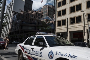 A police cruiser is parked in front of the Toronto Police Services headquarters, in Toronto, Friday, Aug. 9, 2019. (The Canadian Press/Christopher Katsarov)