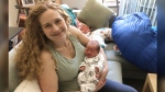 In this photo provided by Liz Chrastil, a neuroscientist with the University of California, Irvine, she her holds her newborn son in May 2020. (Courtesy Liz Chrastil via AP)