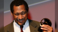 FILE - U.S. writer Percival Everett holds his trophy after he was awarded with the Literary Award at the 38th American Film Festival Sept. 5, 2012, in Deauville, Normandy, France. (AP Photo/Michel Spingler, File)