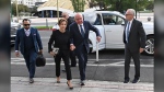 Rupert Murdoch, center, and his wife Elena Zhukova Murdoch arrive at the Second Judicial District Court in Reno, Nev., Monday Sept. 16, 2024. (AP Photo/Andy Barron)