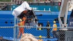 Debris from the Titan submersible, recovered from the ocean floor near the wreck of the Titanic, is unloaded from the ship Horizon Arctic at the Canadian Coast Guard pier in St. John’s on Wednesday, June 28, 2023. THE CANADIAN PRESS/Paul Daly