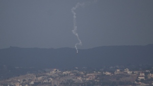 An Israeli army flare is seen over the Israeli-Lebanese border as seen from the Israeli-annexed Golan Heights, Monday, Sept. 16, 2024. (AP Photo/Leo Correa)
