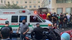 People gather outside the American University hospital after the arrival of several men who were wounded by exploded handheld pagers, in Beirut, Lebanon, Tuesday, Sept. 17, 2024. (Bassam Masri / AP Photo)