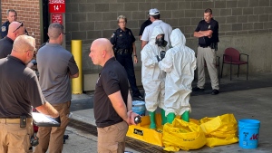 A hazmat crew investigates after a suspicious package was delivered to election officials at the Missouri Secretary of State's Jefferson City, Mo., office on Sept. 17, 2024. (Summer Ballentine / AP Photo)
