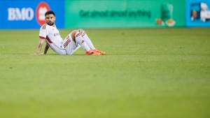 FILE - Toronto FC forward Lorenzo Insigne (24) sits on the turf after losing to Orlando City SC in an MLS soccer match in Toronto on July 3, 2024. THE CANADIAN PRESS/Cole Burston