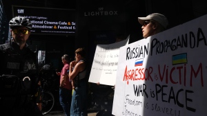 Protesters gather outside the TIFF Lightbox before a screening of the documentary film "Russians At War" in Toronto, Tuesday, Sept. 17, 2024. THE CANADIAN PRESS/Chris Young