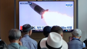 A TV screen shows a file image of North Korea's missile launch during a news program at Seoul Railway Station in Seoul, South Korea, Sept. 18, 2024. (AP Photo/Ahn Young-joon)