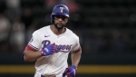 Texas Rangers' Leody Taveras rounds the bases after hitting a two-run home run against the Toronto Blue Jays in the eighth inning of a baseball game in Arlington, Texas, Tuesday, Sept. 17, 2024. (AP Photo/Tony Gutierrez)
