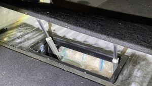 Illicit drugs are found in a concealed compartment in a vehicle in this undated photo. (Australian Federal Police via AP)