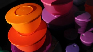 FILE - Colorful Tupperware products are seen in Bellflower, Calif. on Aug. 5, 2011. (AP Photo/Garrett Cheen, File)