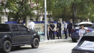 Chinese authorities inspect the scene of a stabbing at the Shenzhen Japanese School in Shenzhen, China Wednesday, Sept. 18, 2024, after a 10-year-old Japanese student was attacked by a man. (Kyodo News via AP)