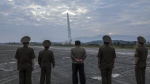 North Korean leader Kim Jong Un, centre, oversees a launch of what the country says is its newly built Hwasongpho-11-Da-4.5 ballistic missile at an undisclosed place in North Korea Wednesday, Sept. 18, 2024.  The content of this image is as provided and cannot be independently verified. (Korean Central News Agency/Korea News Service via AP)