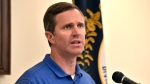 Kentucky Gov. Andy Beshear addresses a crowd gathered at the Breathitt Co. Courthouse to discuss progress in flood recovery efforts in Jackson, Ky., July 26, 2024. (AP Photo/Timothy D. Easley)