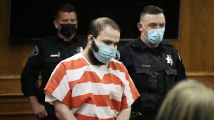 Ahmad Al Aliwi Alissa, accused of killing 10 people at a Colorado supermarket in March 2021, is led into a courtroom for a hearing, Sept. 7, 2021, in Boulder, Colo. (AP Photo/David Zalubowski, Pool, File)