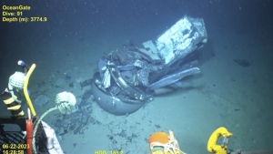 This June 2023 United States Coast Guard still frame from video provided by Pelagic Research Services, shows remains of the Titan submersible, centre, on the floor of the Atlantic Ocean. (U.S. Coast Guard Video courtesy Pelagic Research Services via AP)