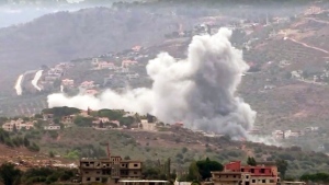 In this image taken from video, smoke is seen rising from the Lebanese village of Kfar Kila after Hezbollah launched rockets into Israel. 