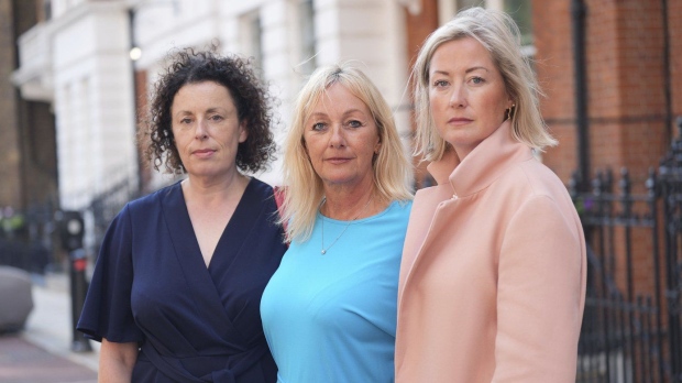 Three of Mr Al Fayed's accusers, left to right, Katherine (no surname given), Lindsay Mason and Gemma (no surname given), pose for a photograph after a press conference at Kent House in Knightsbridge, London, Friday Sept. 20, 2024. (Yui Mok/PA via AP)