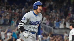 Los Angeles Dodgers' Shohei Ohtani (17) reacts after hitting his 50th home run of the season during the seventh inning of a baseball game against the Miami Marlins, Thursday, Sept. 19, 2024, in Miami. (AP Photo/Marta Lavandier)