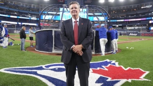 Rogers Communications Inc. executive chair Edward Rogers stands on the field during batting practice ahead of Toronto Blue Jays home opener against Seattle Mariners in American League MLB baseball action in Toronto on Monday, April 8, 2024. Experts say legacy and rising team valuations are likely at the heart of what motivated Rogers to add to the company's portfolio of Toronto professional sports teams. THE CANADIAN PRESS/Chris Young